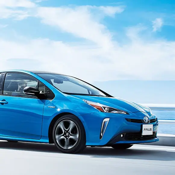 Toyota Prius hybrid driving on a coastal road
