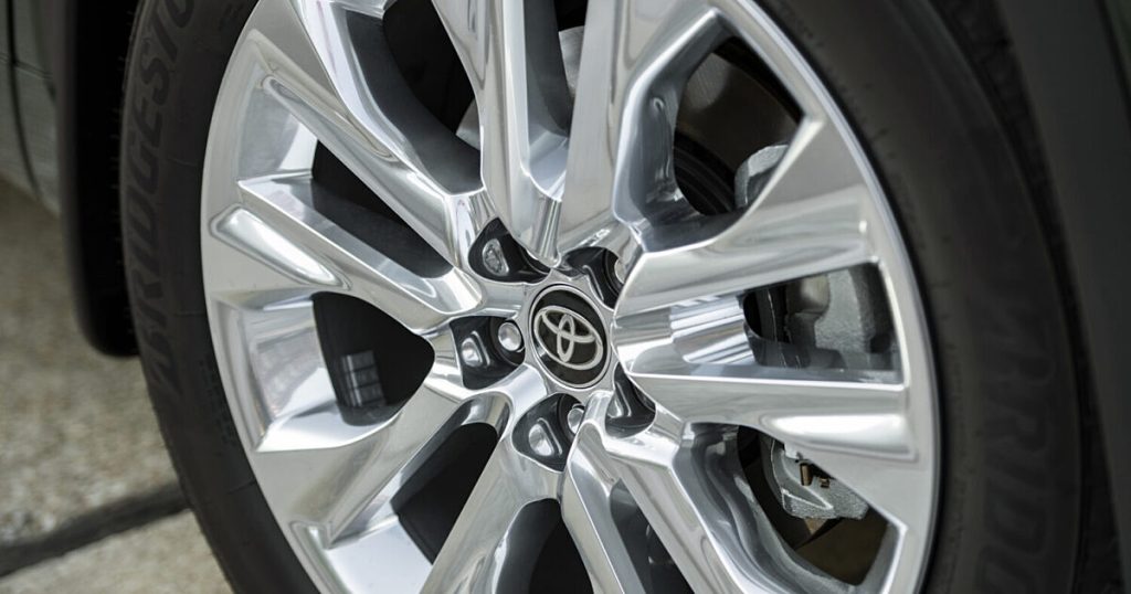 Close-up of a polished alloy wheel with the Toyota logo on the center cap