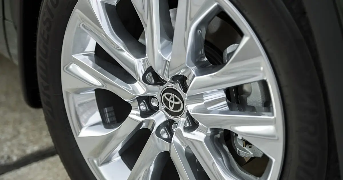 Close-up of a polished alloy wheel with the Toyota logo on the center cap
