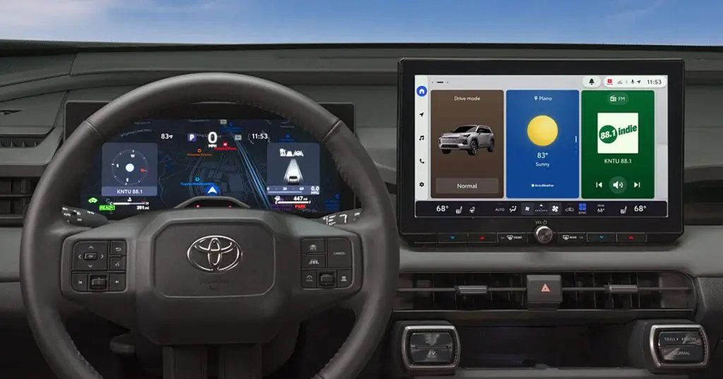 Toyota multimedia touchscreen and digital instrument cluster behind the steering wheel