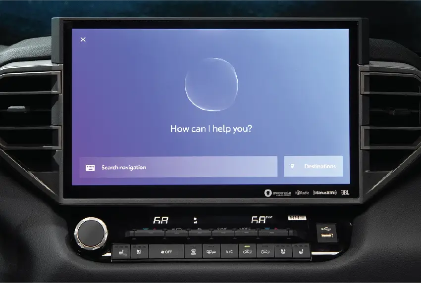 In-car touchscreen displaying a voice assistant asking How can I help you